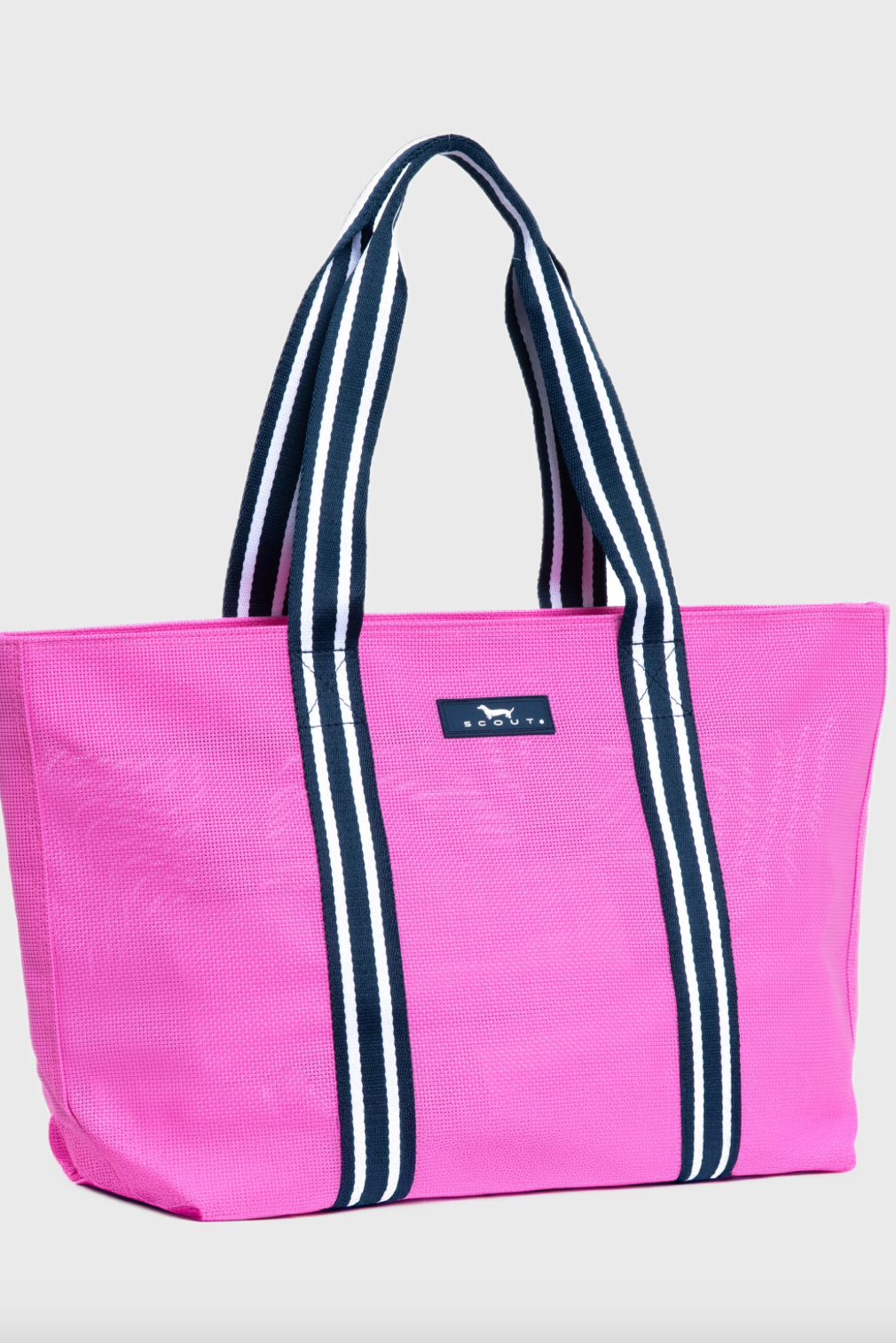 Pink tote bag with navy stripes on a light gray background