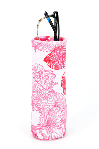Pink floral-patterned cylindrical container with a pair of glasses on a white background