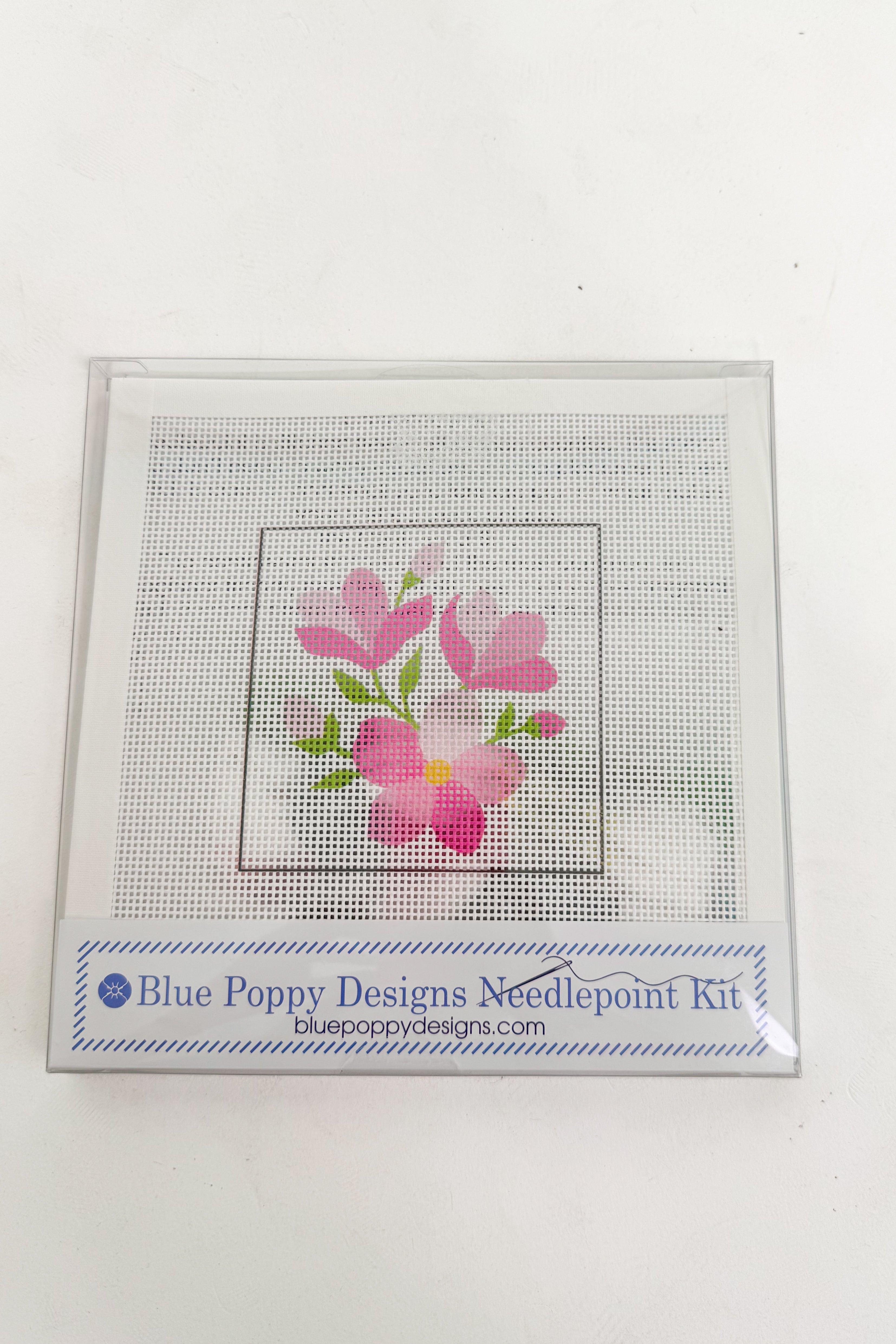 Blue Poppy Designs needlepoint kit with pink flowers on a white background