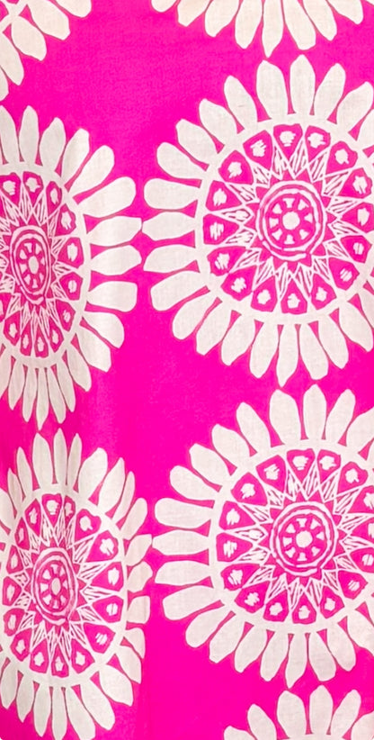 detail shot of pink dress with white floral print design