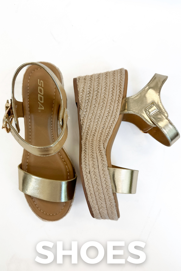 Gold sandals with woven platform sole on a white background