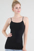 Woman wearing a black tank top against a plain background