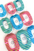 Colorful striped round flat teletie hair clips on a white background