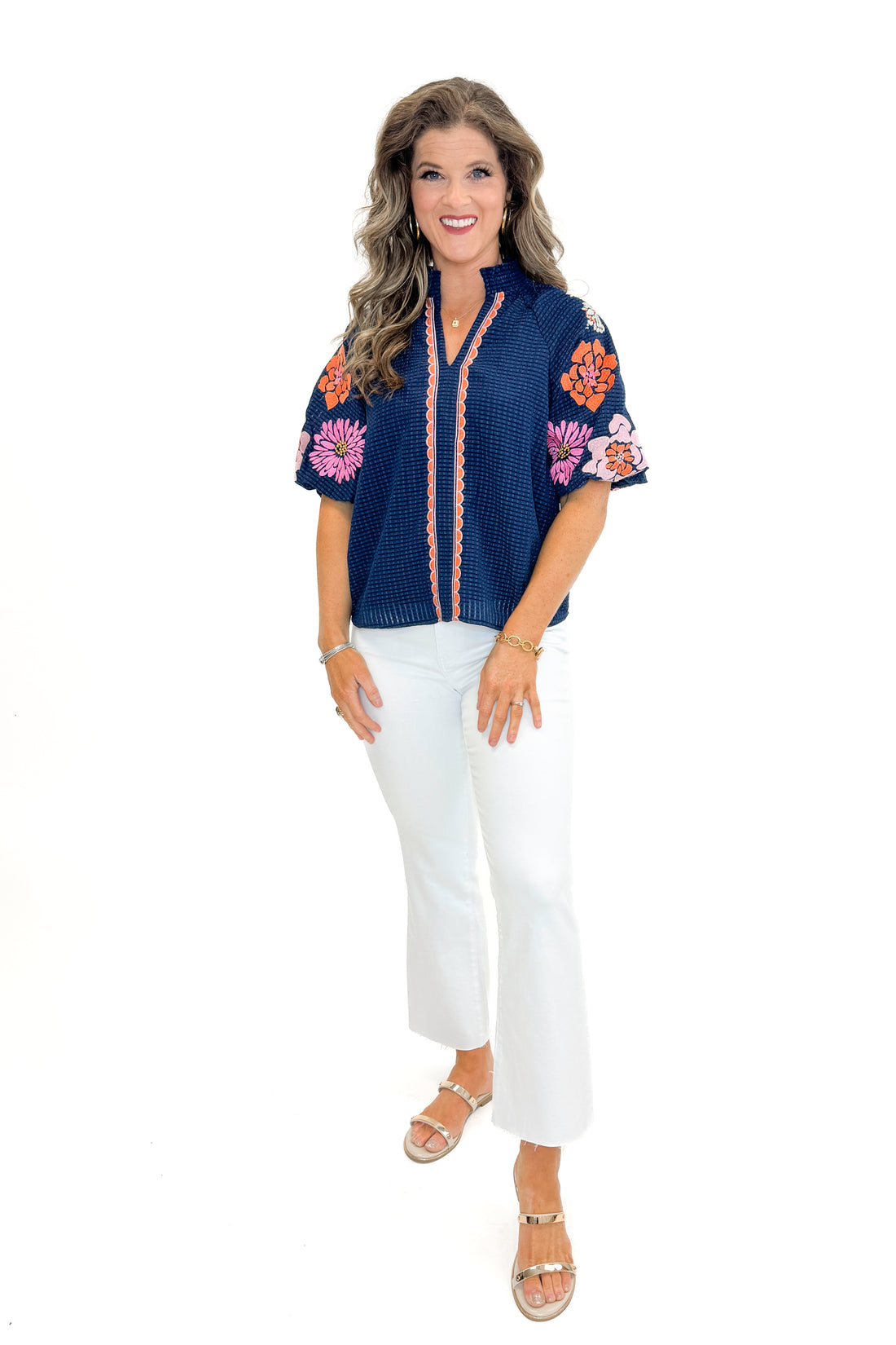 Front view of woman wearing Navy Textured &amp; Floral Embroidered Top by THML with jeans against white studio background.